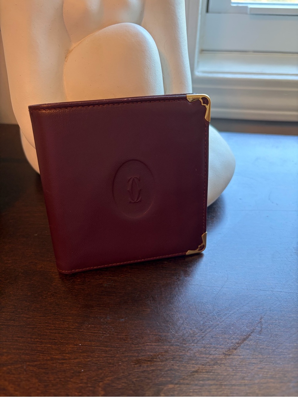Cartier Burgundy Leather Wallet with Gold Corner Accents comes with a coa